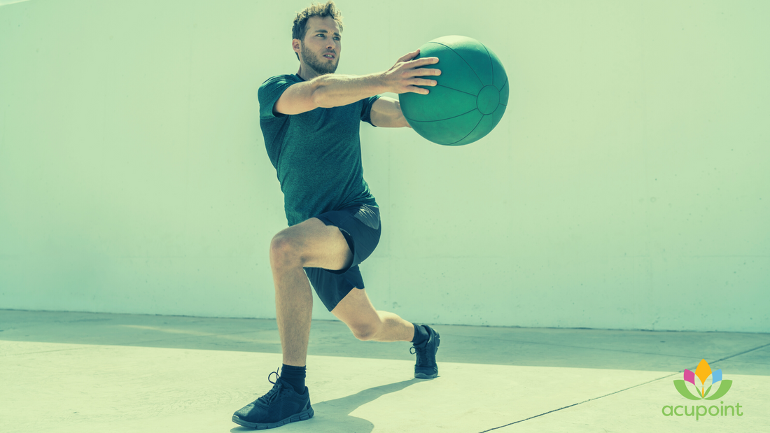 Man exercising while holding a ball